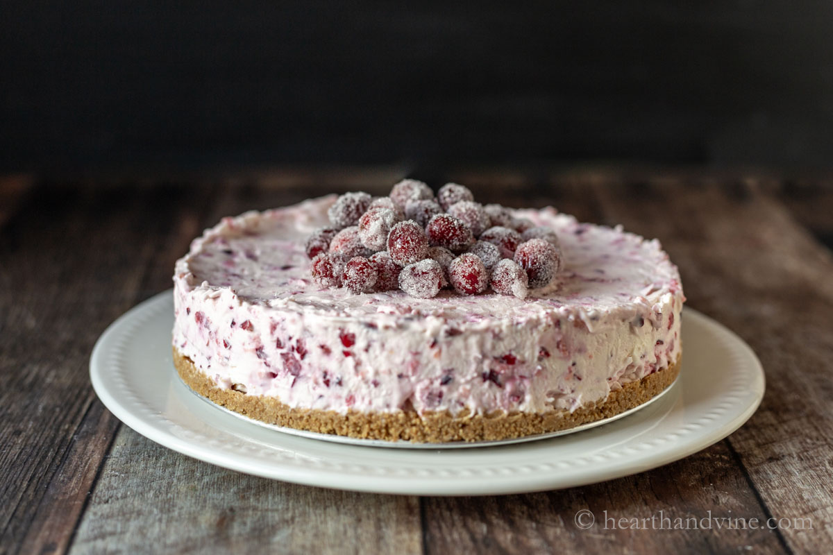 Side view of the completed cranberry cheesecake.