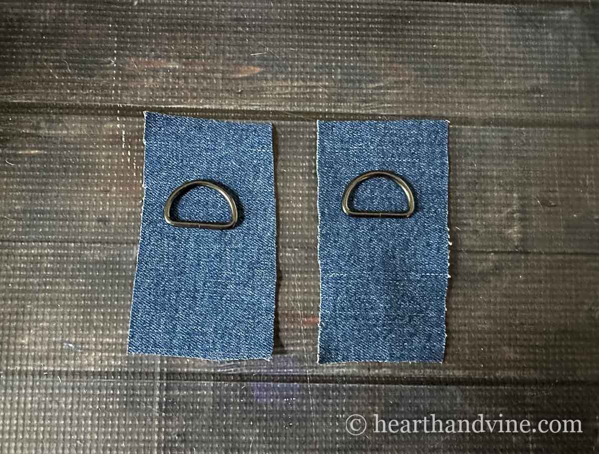 Two pieces of jean material and two D rings.
