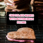 Stacks of chocolate heart cookies with pink buttercream filling.