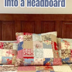 An old door headboard for a king bed with a patchwork quilt.