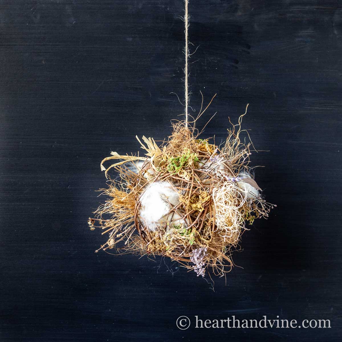 Hanging nesting material ball for birds.