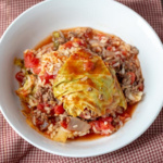 A single serving bowl of stuffed cabbage casserole.