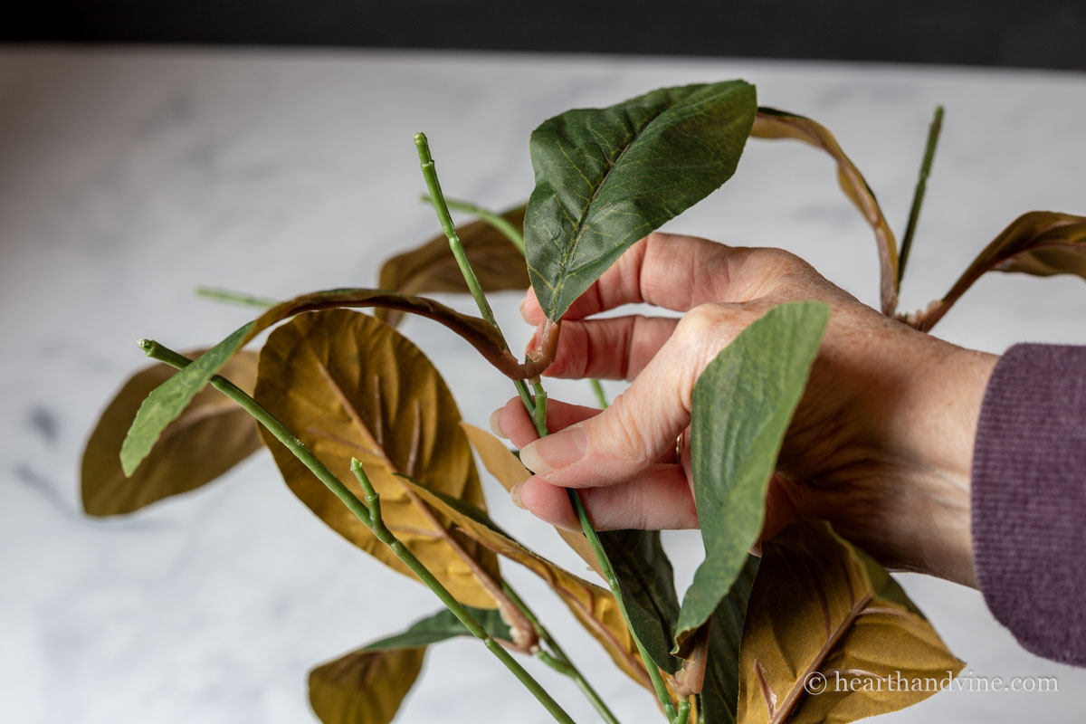Grouping pairs of leaves on an artificial stem.