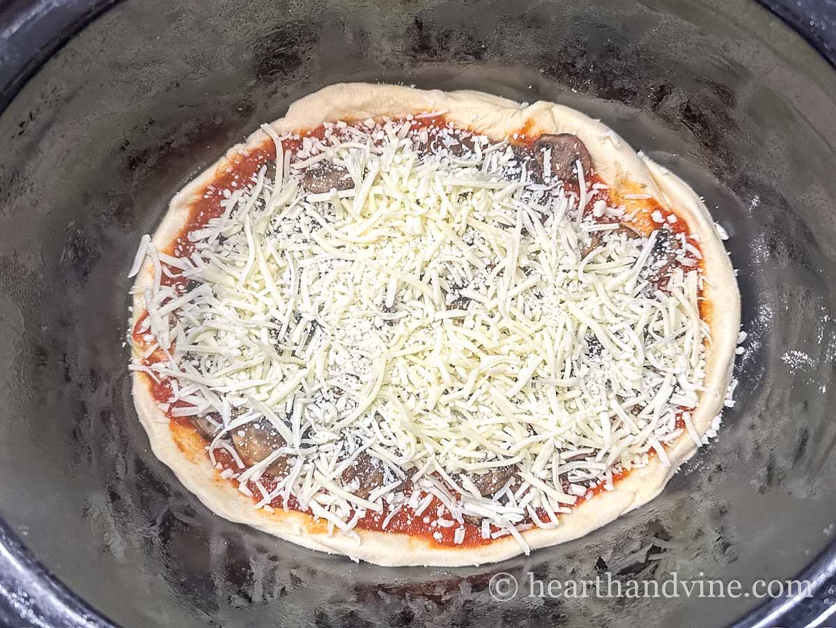 Pizza assembled in a slow cooker.