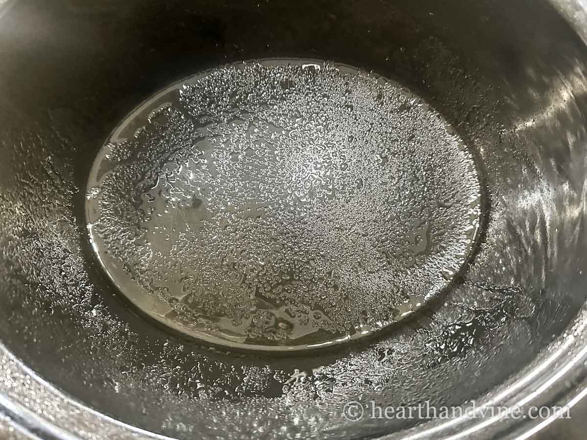 Olive oil sprayed all over in a slow cooker.