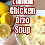 Bowl of lemon soup with chicken and wedges of fresh lemons on the side.