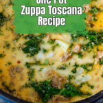 A close up of zuppa toscana soup in a Dutch oven.