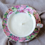 Aerial view of a pink flower teacup candle.