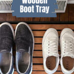 Two pairs of shoes on a wood slatted mat.