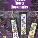 Five pressed flower bookmarks on a table.