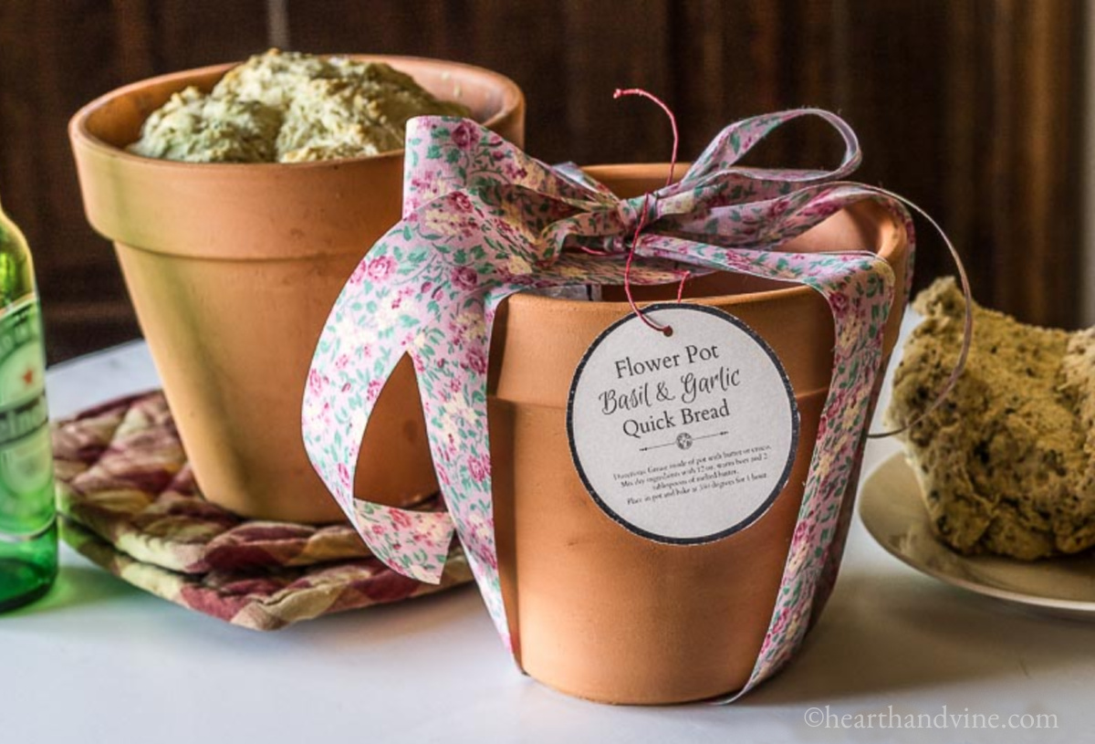 Two clay pots with beer bread. One wrapped as a gift.