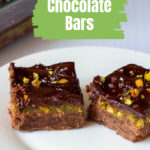 Two plated pistachio chocolate bars.