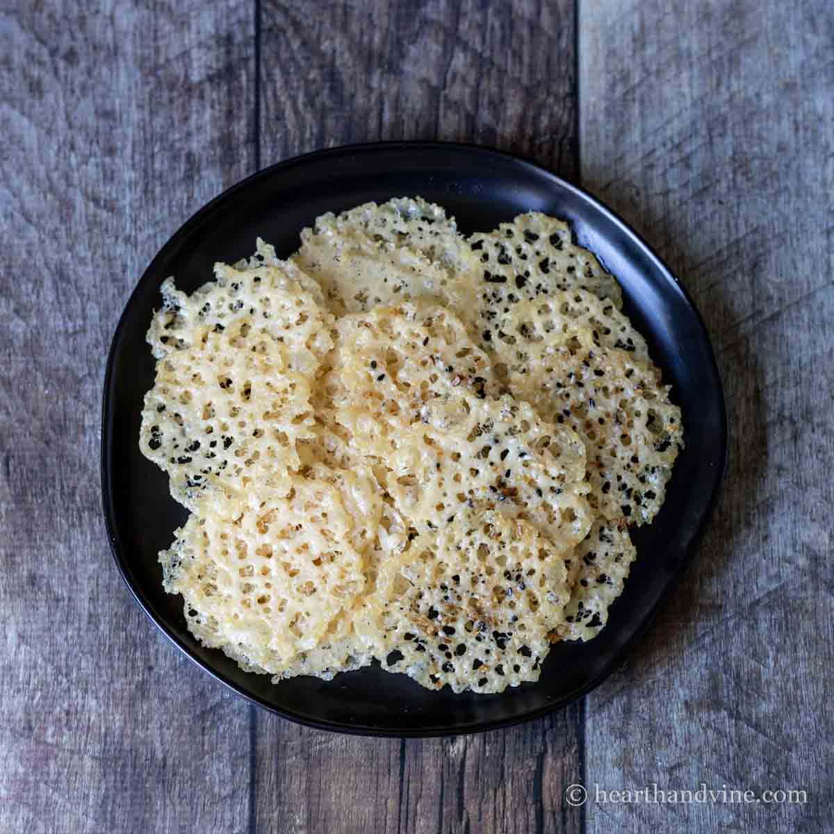 Plate full of parmesan cheese crisps.