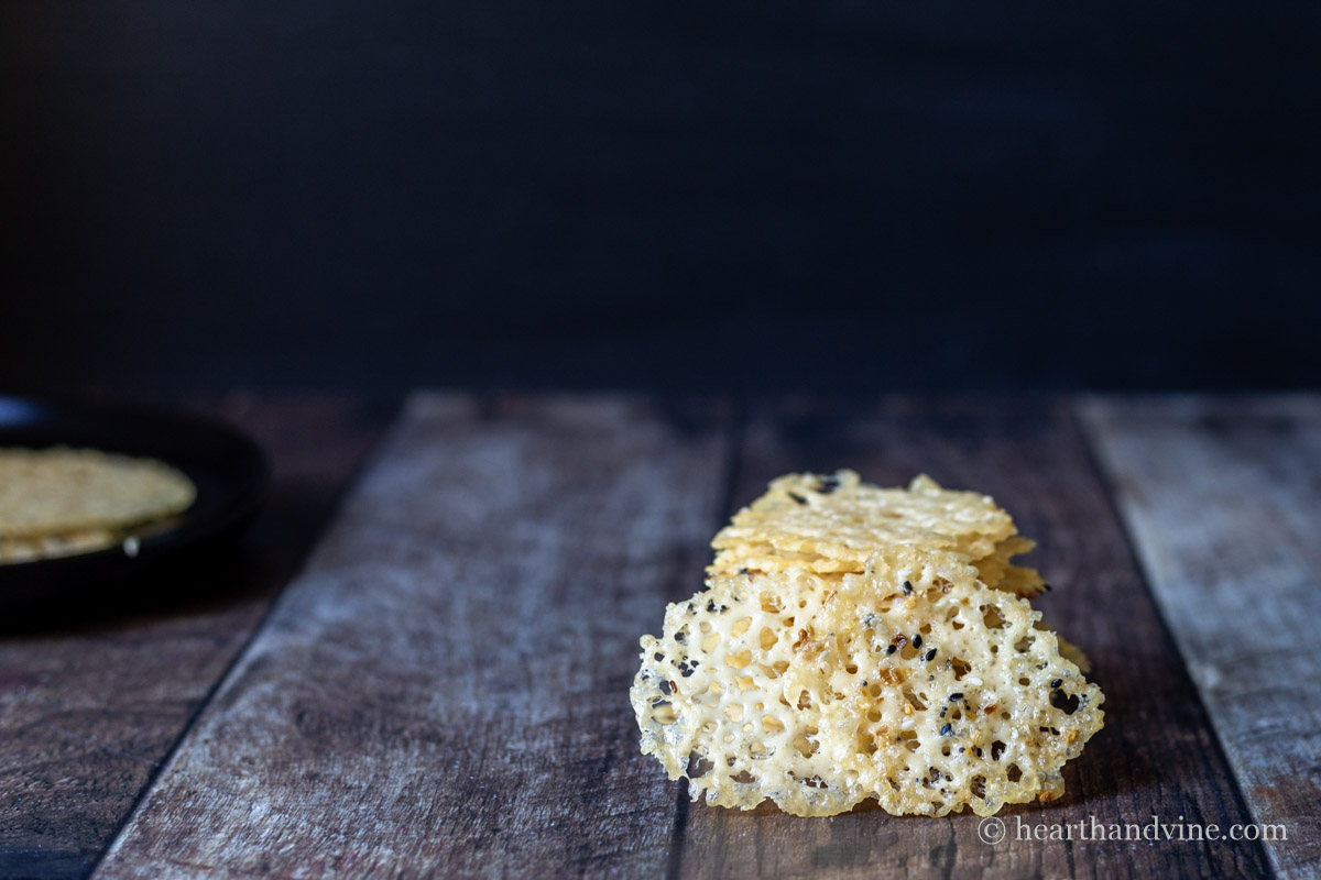 A stack of Parmesan cheese crisps on a table.