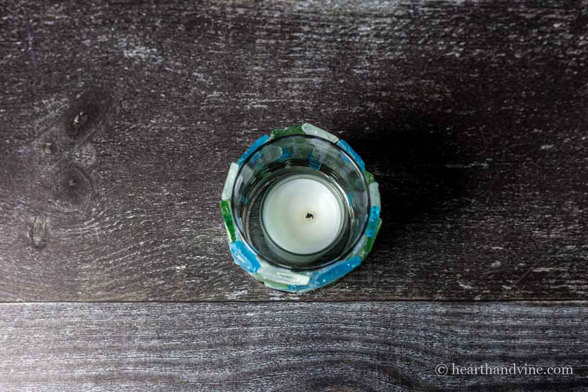 Aerial view of the sea glass candle holder with a small votive inside.