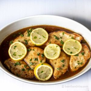Chicken piccata in a serving dish.