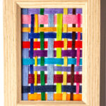 A small framed off loom weaving art piece.