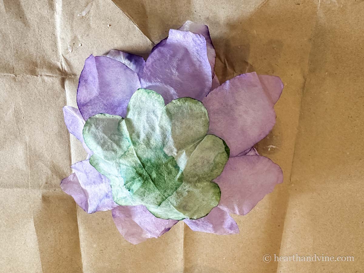 Green flower glued to the base of the flower.