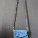 A mini jean pocket bag with a long strap.