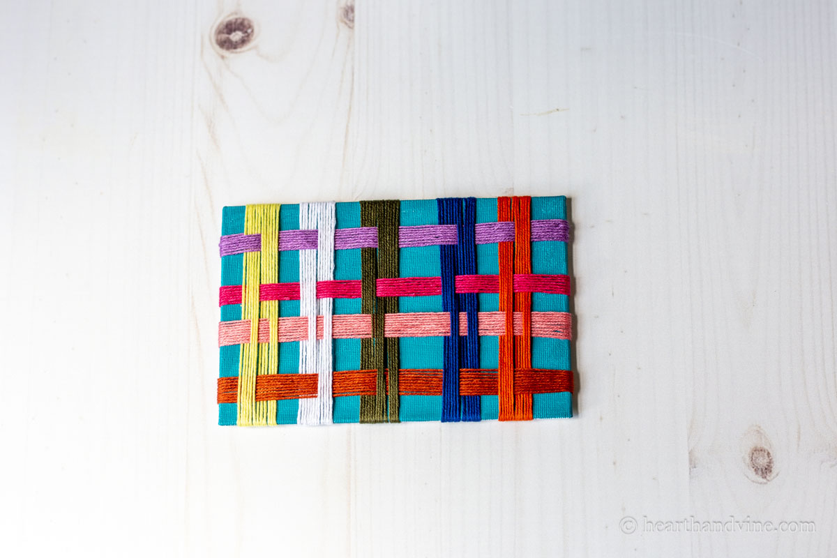 Off loom weaving in process.