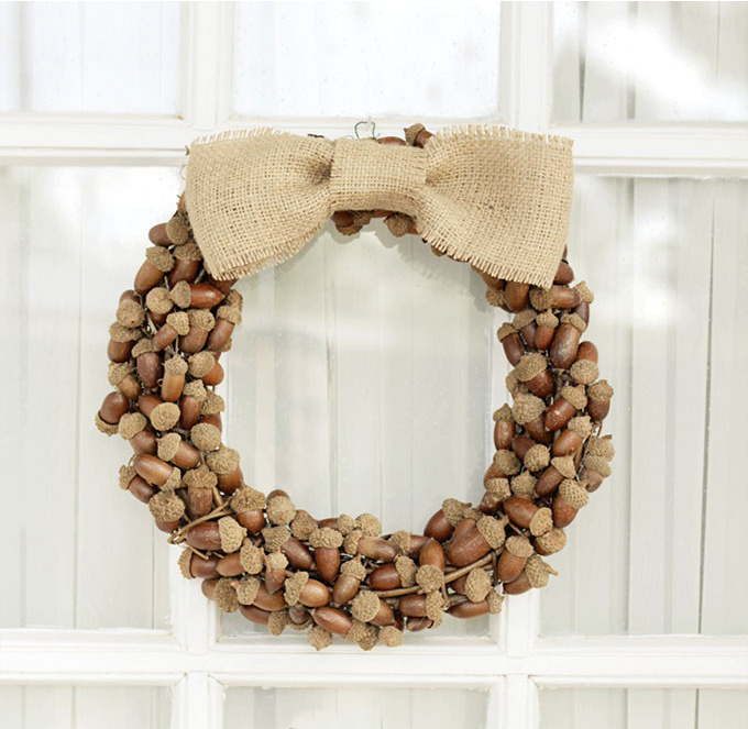 Acorn wreath with cream bow.