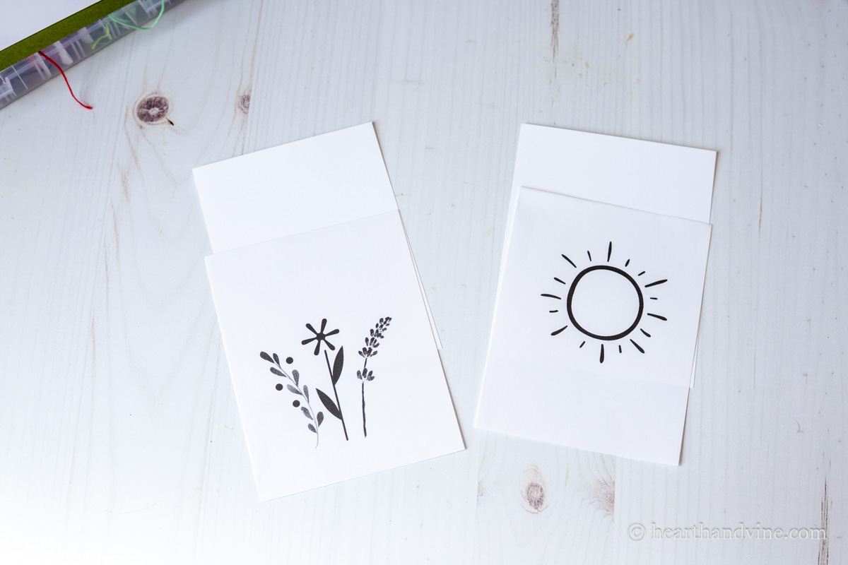 Two card designs cut down to 1/4 page. One has three flowers and one a sun.