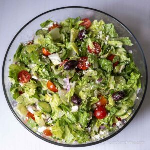 Large Greek salad in a glass bowl.