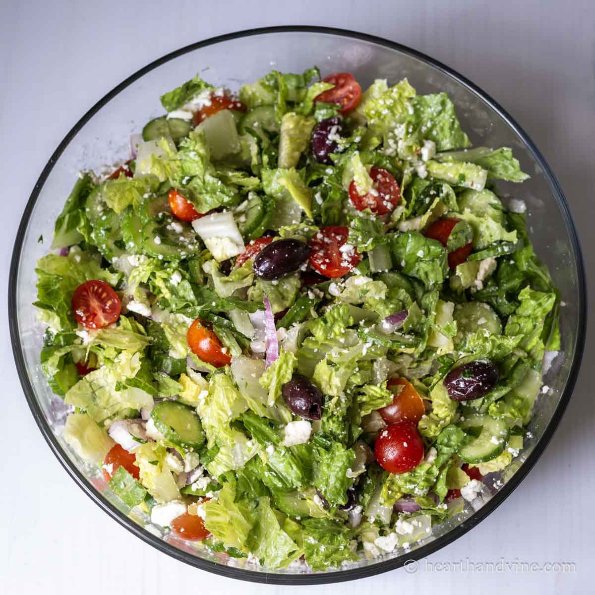 Large Greek salad in a glass bowl.