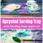 Bleeding tissue paper art tray over a paintbrush working on a leaf.