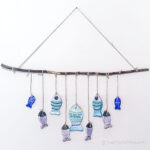 Clay fish craft wall hanging on wall.