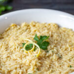 Partial view of a bowl of lemon rice.
