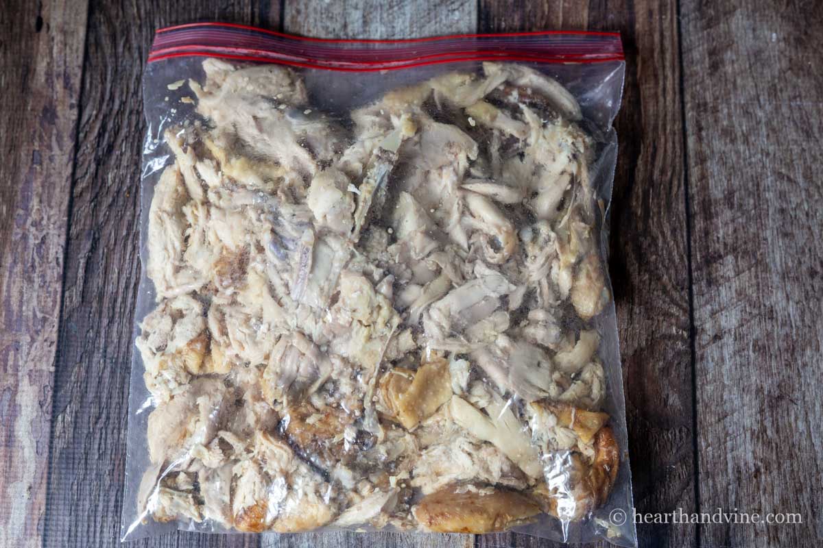 Rotisserie chicken massaged in plastic bag.