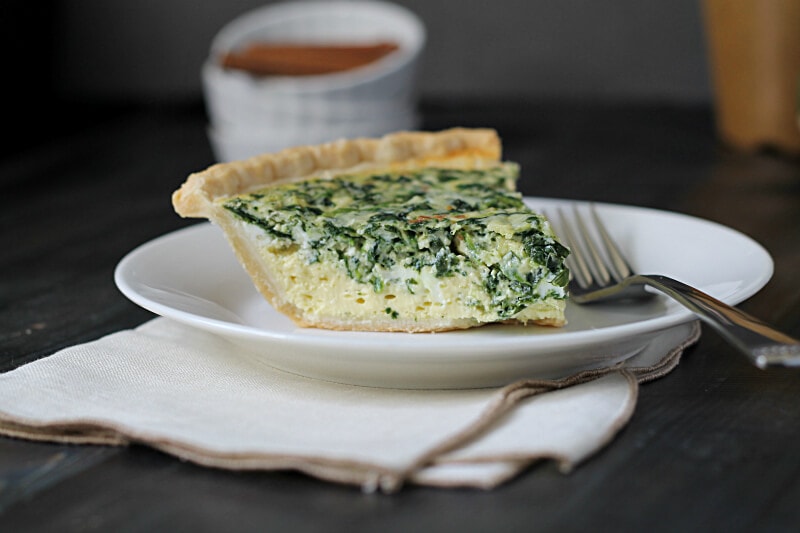 Slice of spinach holiday quiche