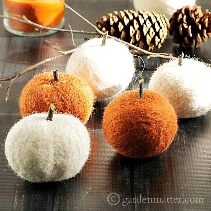 Learn how to make felted dryer ball pumpkins. Use them for your fall decor now, and in the dryer later.