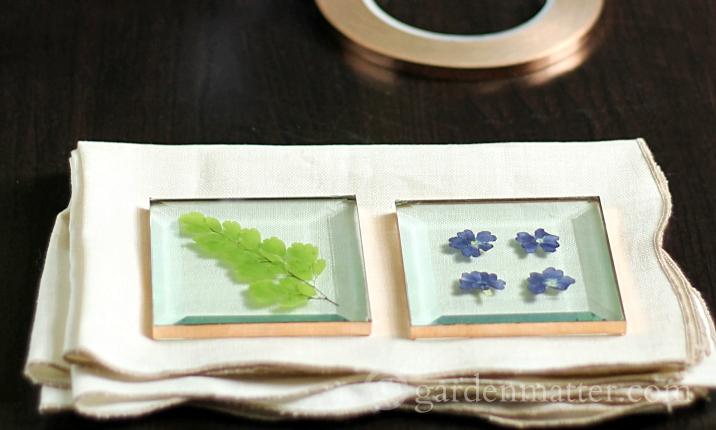 Using square glass and copper tape you can make beautiful coaster from your own flowers in no time and not a lot of money.