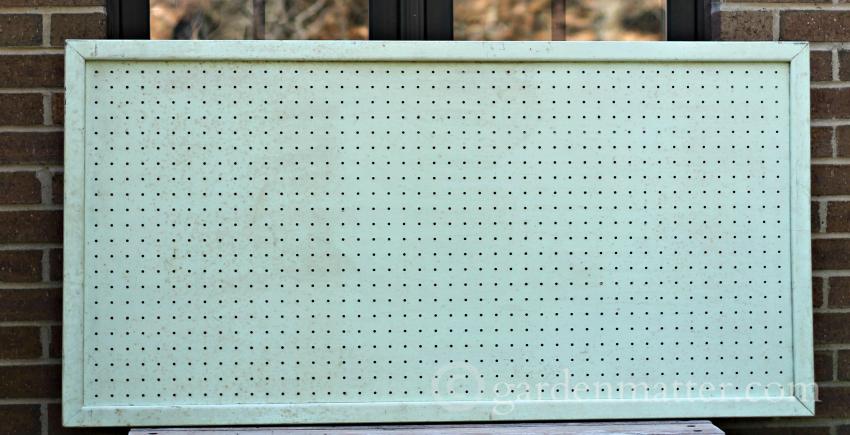 Old green pegboard