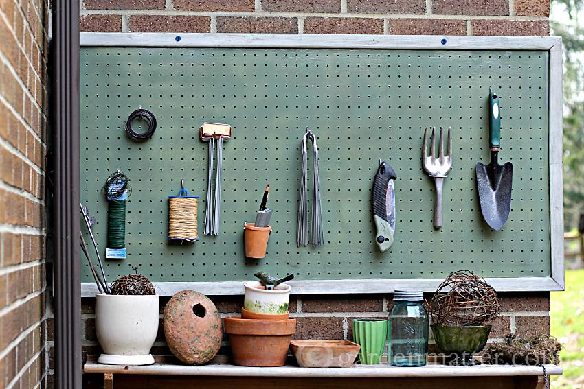 Adding a pegboard to your potting bench is a great decorative touch and a great way to organize all your gardening and other outdoor supplies.